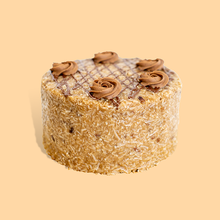 A German chocolate cake from Gambino's, layered devil's food under a coconut coating