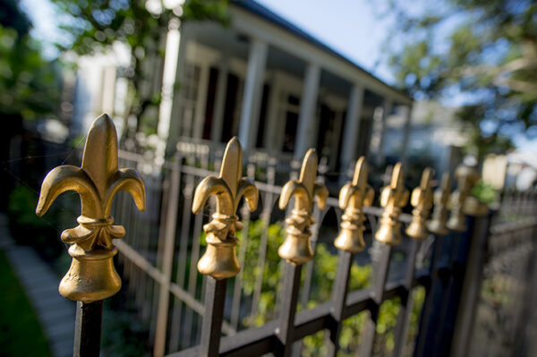 fleur de lis iron fence design in New Orleans symbolizing French heritage and Catholic tradition