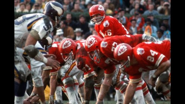 Kansas City Chiefs quarterback lining up against Minnesota Vikings defense during early Super Bowl game representing historic NFL matchup in New Orleans