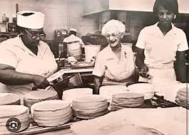 "bakery staff preparing cakes in Gambinos Bakery kitchen representing Beulah Ledner legacy in New Orleans dessert history