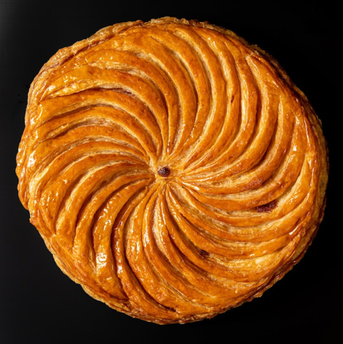 The Roman Saturnalia cake is believed to look something like this galette des rois from northern France. The cake is circular and golden like the sun, which is what Saturnalia is celebrating.