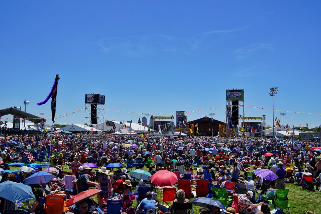 The sun shines on the crowd at a New Orleans Jazz and Heritage Festival.