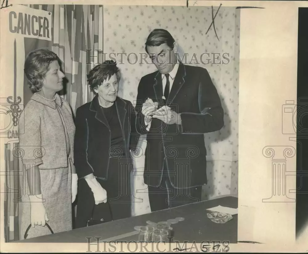 Gregory Peck signs autographs at an American Cancer Society event in New Orleans on April 5, 1966.