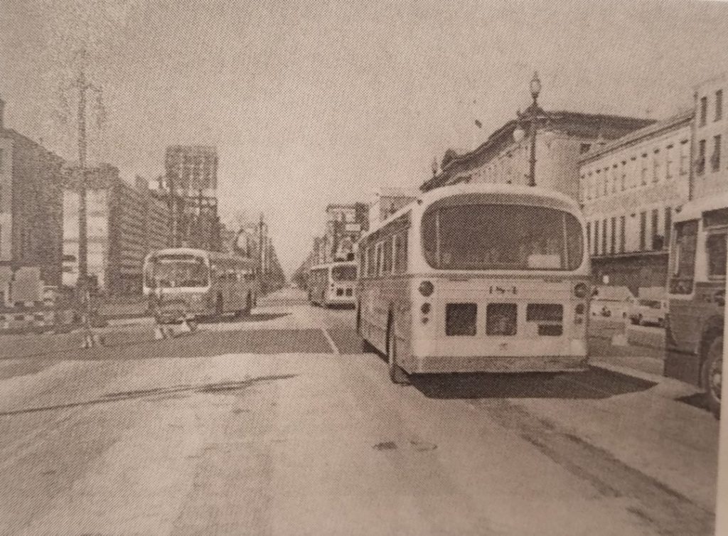 Canal Street in the 1960s with General Motors and Fixible buses operating along neutral ground once occupied by streetcars. Photographs taken from The Streetcars of New Orleans by Louis C. Hennick, © Louis C. Hennick, used by permission of the publisher, Pelican Publishing.