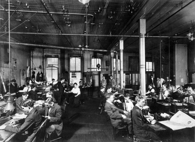 The New Orleans Item newsroom at work, circa 1900.